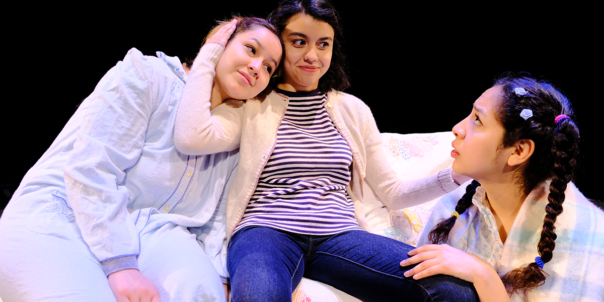 Photo of actors Clarissa Gonzalez, Regina Leon and Caroline Sanchez sitting on a couch